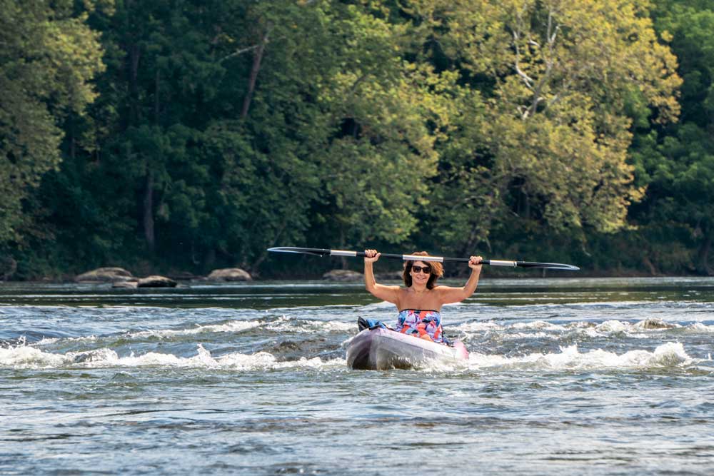 Woman in kayak on New River near Fries, Virginia