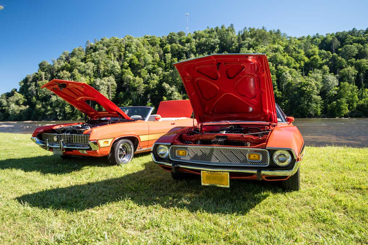 Two classic cars being shown at the Thunder on the River car show Fries, VA
